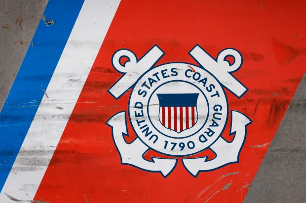 SAN DIEGO, CALIFORNIA - SEPTEMBER 26: A U.S. Coast Guard logo is displayed on the side of a patrol boat on September 26, 2025 in San Diego, California. (Photo by Kevin Carter/Getty Images)
