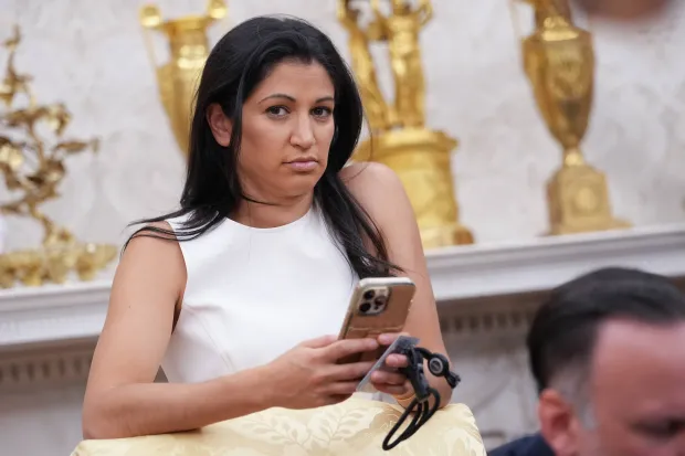 White House Deputy Chief of Staff Stephen Miller's wife, Katie Miller, listens as U.S. President Donald Trump and Tesla CEO Elon Musk speak to reporters in the Oval Office of the White House on May 30, 2025 in Washington, DC. (Photo by Kevin Dietsch/Getty Images)