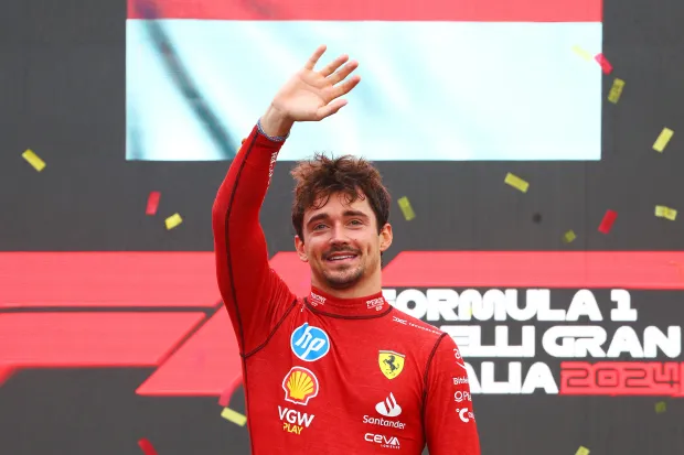 MONZA, ITALY - SEPTEMBER 01: Race winner Charles Leclerc of Monaco and Ferrari celebrates on the podium during the F1 Grand Prix of Italy at Autodromo Nazionale Monza on September 01, 2024 in Monza, Italy. (Photo by Clive Rose/Getty Images)