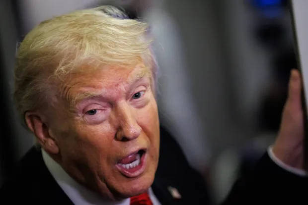 WEST PALM BEACH, FLORIDA - NOVEMBER 02: U.S. President Donald Trump speaks to reporters aboard Air Force One en route to the White House on November 2, 2025 after taking off from Palm Beach International Airport in West Palm Beach, Florida. Trump spent the weekend at his Mar-A-Lago estate in Palm Beach, Florida. (Photo by Samuel Corum/Getty Images)