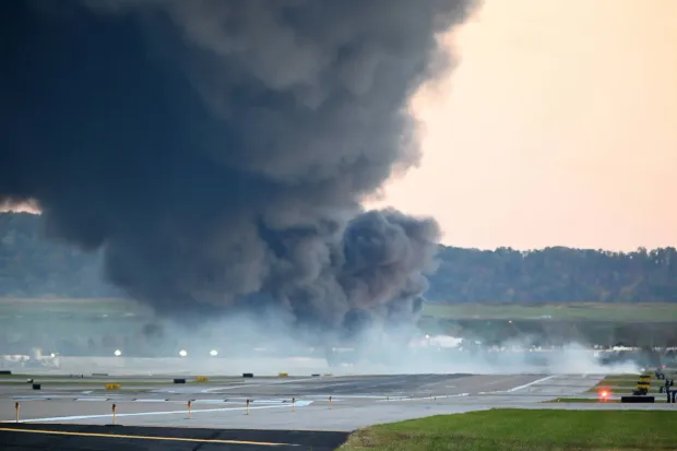 Fire and smoke mark where a UPS cargo plane crashed near Louisville Muhammad Ali International Airport on November 04, 2025 in Louisville, Kentucky. (Photo by Stephen Cohen/Getty Images)