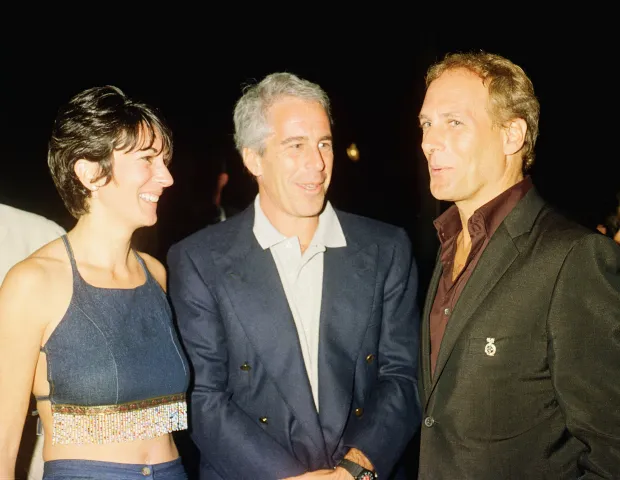 (L-R) Ghislaine Maxwell, Jeffrey Epstein, and musician Michael Bolton pose for a portrait during a party at the Mar-a-Lago club, Palm Beach, Florida, February 12, 2000. (Photo by Davidoff Studios/Getty Images)