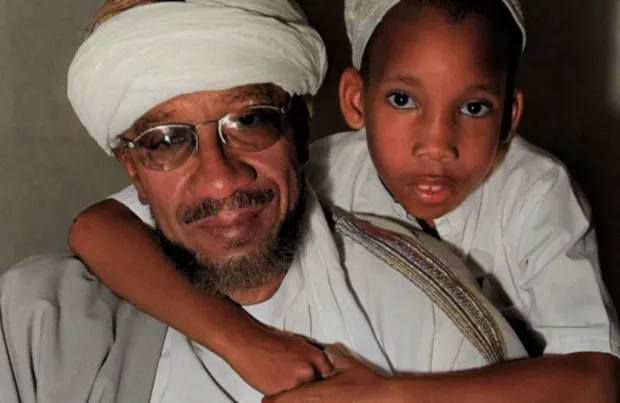 Jamil Al-Amin, aka H Rap Brown, with his son Kairi Al-Amin (Image via Facebook/Kairi Freemyfather Al-Amin)