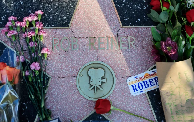 Flowers rest on Rob Reiner's star on the Hollywood Walk of Fame on December 15, 2025 in Los Angeles, California. The LAPD confirmed that Rob Reiner and his wife Michele Singer Reiner were found dead in their Brentwood home. Their son Nick has been arrested in connection to their deaths. (Photo by Mario Tama/Getty Images)