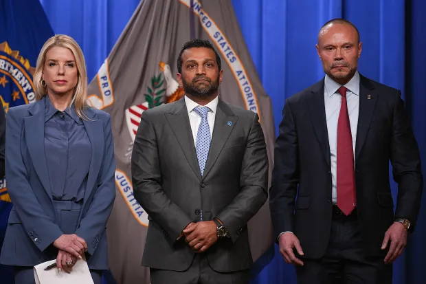WASHINGTON, DC - DECEMBER 04: Attorney General Pam Bondi (L), FBI Director Kash Patel (C) and FBI Deputy Director Dan Bongino hold a news conference about the January 6th pipe bomber at the Department of Justice on December 4, 2025 in Washington, DC. Federal agents have arrested a suspect they are charging with placing two pipe bombs, which never exploded, the night before the January 6th, 2021 U.S. Capitol attack. (Photo by Andrew Harnik/Getty Images)