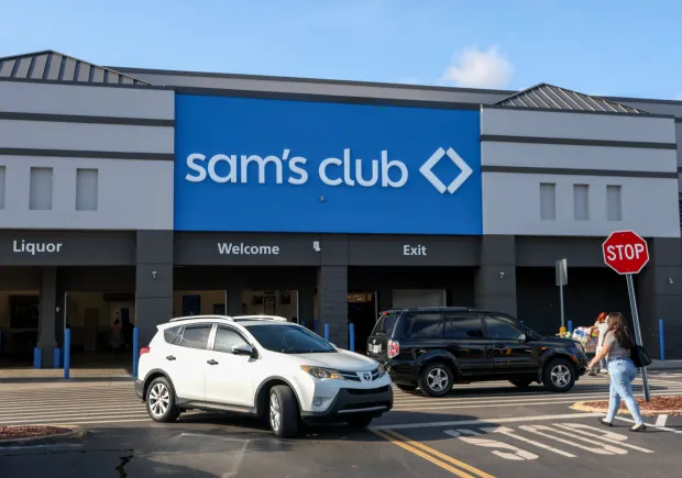 A Sam's Club sign hangs on the wall of a store on July 07, 2025 in Miami, Florida. The first Sam's Club also opened in 1983, in Midwest City, Oklahoma. The business is headquartered in Bentonville, Arkansas, along with its sister company Walmart. (Photo by Joe Raedle/Getty Images)
