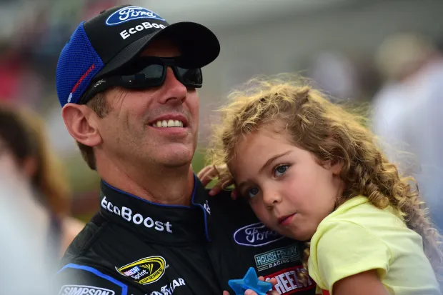 DAYTONA BEACH, FL - JULY 02:  Greg Biffle, driver of the #16 Ford EcoBoost Ford, holds daughter Emma Elizabeth on the grid during the NASCAR Sprint Cup Series Coke Zero 400 Powered By Coca-Cola at Daytona International Speedway on July 2, 2016 in Daytona Beach, Florida.  (Photo by Jared C. Tilton/Getty Images)