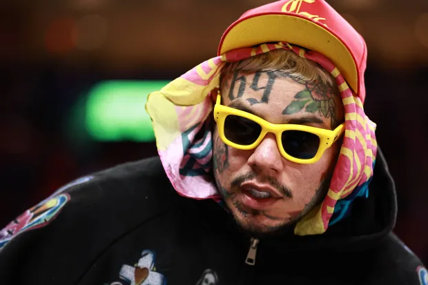 Tekashi 6ix9ine is seen during the second half of a game between the Miami Heat and the Cleveland Cavaliers at Kaseya Center on November 12, 2025 in Miami, Florida. NOTE TO USER: User expressly acknowledges and agrees that, by downloading and or using this photograph, User is consenting to the terms and conditions of the Getty Images License Agreement. (Photo by Carmen Mandato/Getty Images)