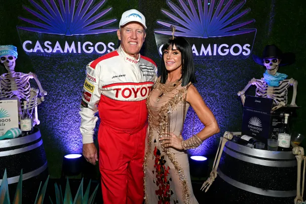John Elway and Paige Elway attend the Casamigos Halloween Party Returns in Beverly Hills (Image via Getty)