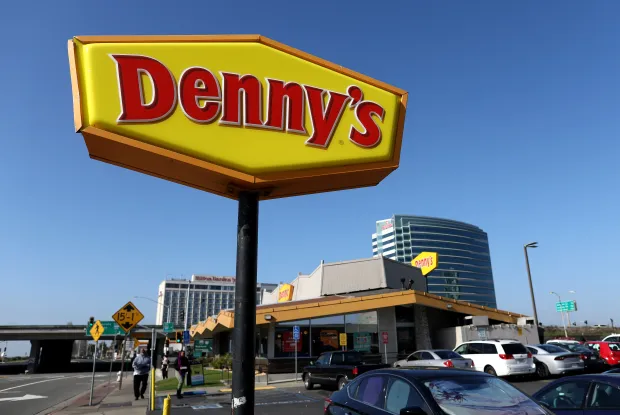 A sign is posted in front of a Denny's restaurant on February 13, 2023 in Emeryville, California. Denny's restaurant will report fourth quarter earnings today after the closing bell. (Photo by Justin Sullivan/Getty Images)
