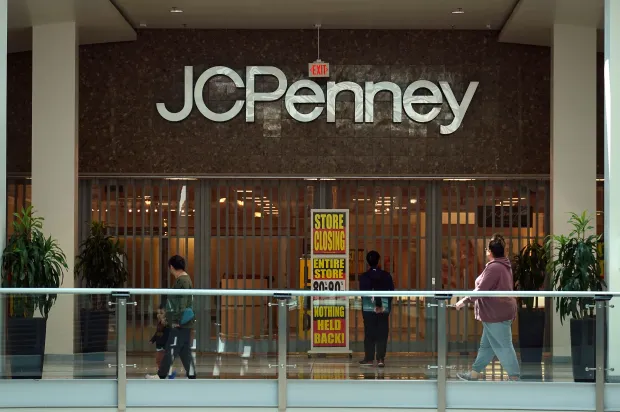 People walk by a JCPenney store that is set to close on May 22, 2025 in San Francisco, California. Retailer JCPenney will permanently close seven of its stores across the United States on Sunday, May 25, as the company continues to restructure after filing for bankruptcy in 2020. (Photo by Justin Sullivan/Getty Images)